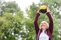 senior sportswoman exercising with medicine ball