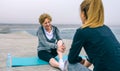 Senior sportswoman laughing with young woman