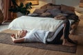 Senior sporty woman practicing yoga, lying on floor resting after yoga