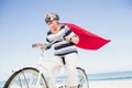 Senior superwoman on a bike