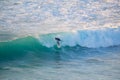 Senior surfer riding a perfect wave.