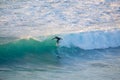 Senior surfer riding a perfect wave.