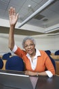 Senior Teacher Raising Hand