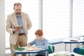 Senior Teacher Watching Student Royalty Free Stock Photo