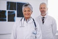 Senior team of doctors in portrait, smile in radiology with woman in leadership and man in hospital. Surgeon, healthcare