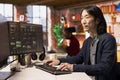 Senior technician coding advanced AI algorithm in startup office
