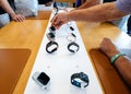 Senior testing Apple Store with Apple Watch Series 4 smartwatch