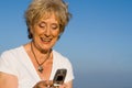 Senior text message,mobile cell phone Royalty Free Stock Photo