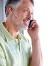 Senior, thinking or happy man on a phone call listening or talking for communication to relax. Confident, retirement or