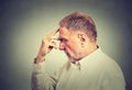 Senior thoughtful man isolated on gray wall background Royalty Free Stock Photo