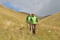 Senior tourist couple hiking at the beautiful mountains Royalty Free Stock Photo