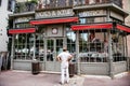 senior tourist male looking at the closed Bistrot Vignes and Boeuf restaurant