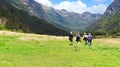 Senior tourists hiking hrough the valley