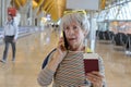 Senior traveler getting upsetting news on the phone