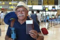 Senior traveler showing his passport
