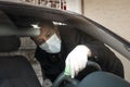 Senior Turkish man disinfects his car Royalty Free Stock Photo