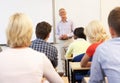 Senior tutor teaching class Royalty Free Stock Photo