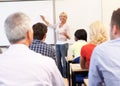 Senior tutor teaching class Royalty Free Stock Photo