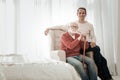 Senior unshaken man sitting on the chair and looking straight. Royalty Free Stock Photo