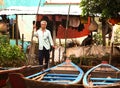 Senior veitnamese man with boats