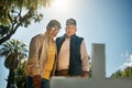 Senior veteran men, tombstone and respect for military, navy or memorial in cemetery for grief, support or empathy Royalty Free Stock Photo