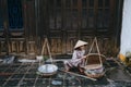 senior vietnamese woman selling food on street in Hoi An, Vietnam Royalty Free Stock Photo