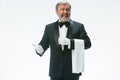 Senior waiter holding white towel