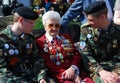 Senior war veteran and two young military men