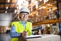 Senior warehouse woman worker with barcode scanner. Royalty Free Stock Photo