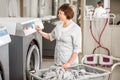 Senior washwoman in the laundry