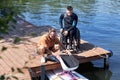 Senior water sports instructor preparing adaptive wakeboarding equipment