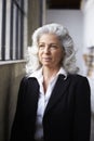 Senior white businesswoman looking away, portrait