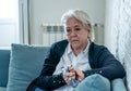 Senior widow woman lonely and sad feeling depressed at home Royalty Free Stock Photo