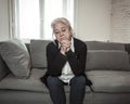 Senior widow woman lonely and sad feeling depressed at home Royalty Free Stock Photo