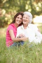 Senior Woman With Adult Daughter In Park Royalty Free Stock Photo