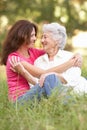 Senior Woman With Adult Daughter In Park Royalty Free Stock Photo