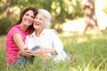 Senior Woman With Adult Daughter In Park Royalty Free Stock Photo