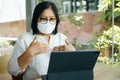 Senior woman aged 60-69 years using tablet, watching lesson Sign language online course communicate by conference video call from