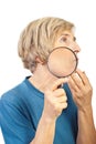 Senior woman analyze her wrinkles with loupe