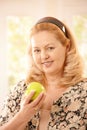 Senior woman with apple Royalty Free Stock Photo