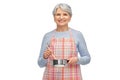 senior woman in apron with pot cooking food Royalty Free Stock Photo