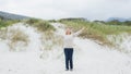 Senior woman with arms outstretched at beach Royalty Free Stock Photo