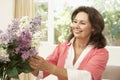 Senior Woman Arranging Flowers Royalty Free Stock Photo