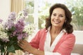 Senior Woman Arranging Flowers