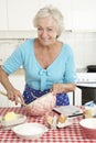 Senior Woman Baking In Kitchen Royalty Free Stock Photo