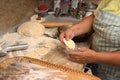 Senior woman baking pies in her home kitchen.Grandma cooks pies. Home cooked food. omemade mold cakes of the dough in Royalty Free Stock Photo