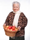 Senior woman with basket of apples Royalty Free Stock Photo