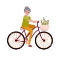 Senior woman on the bicycle. Elderly activity. Old Lady goes to sport, cycles. Elegant person is sitting on the bicycle with