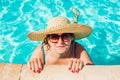 Senior woman relaxing in hotel swimming pool. People enjoying summer vacation. All inclusive Royalty Free Stock Photo