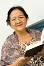 Senior woman and book